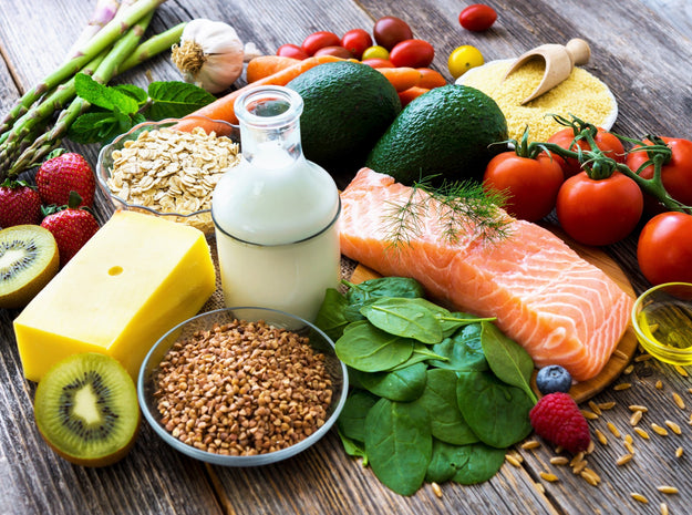 Selection of healthy food on rustic wooden background